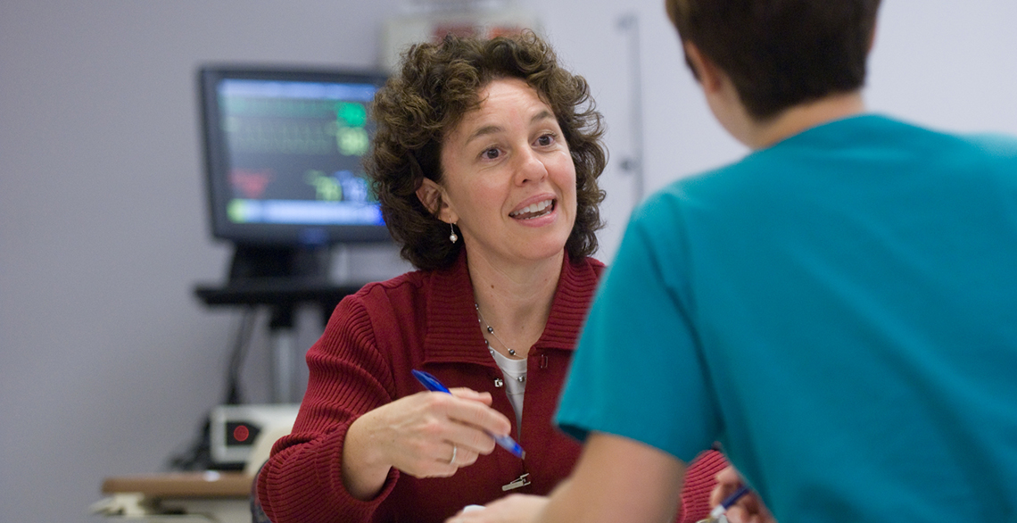 Faculty mentor talking to a student