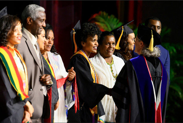 Dean Kirschling shaking a graduates hand 