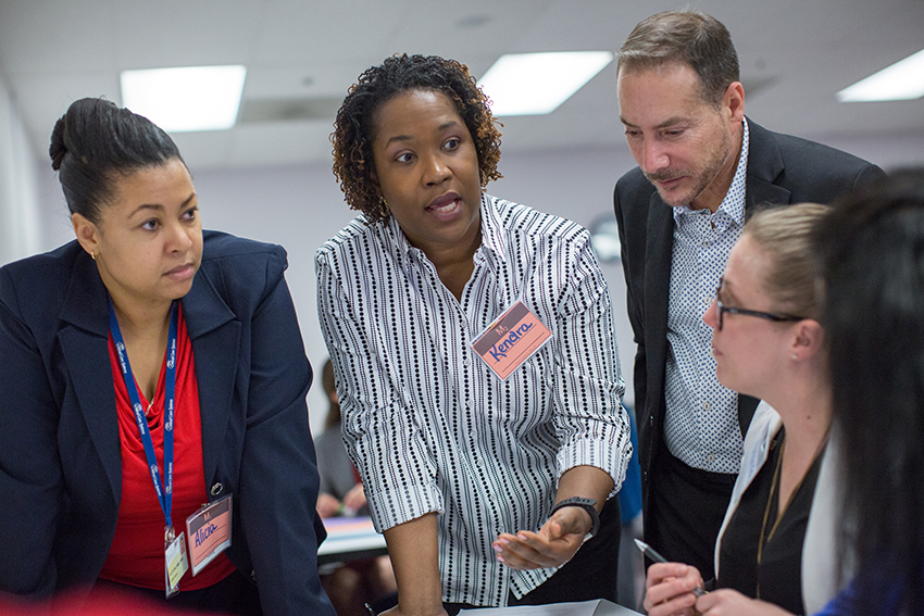 Nurse Leadership Institute Fellows discussing a group project