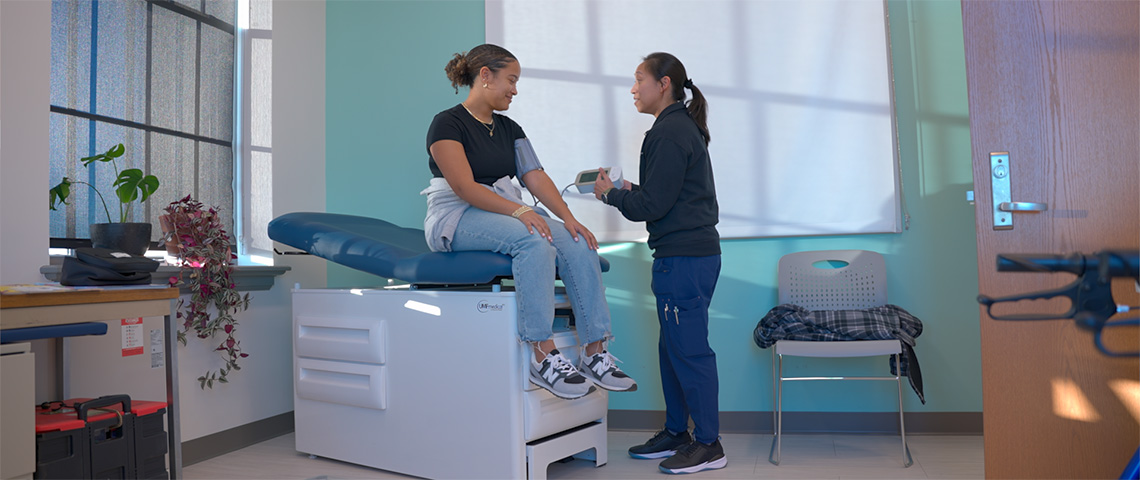 A faculty member takes a patients blood pressure