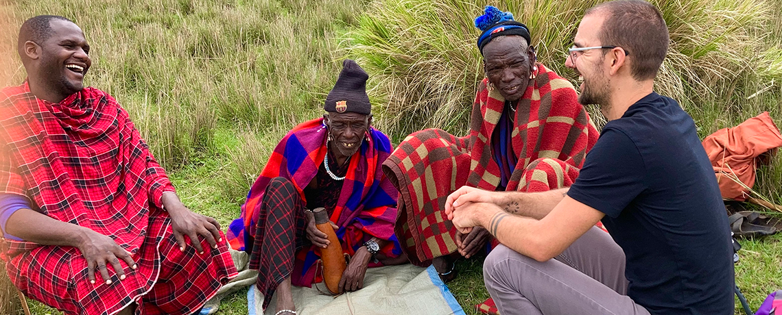 Eli Snyder talks with members of an African tribe