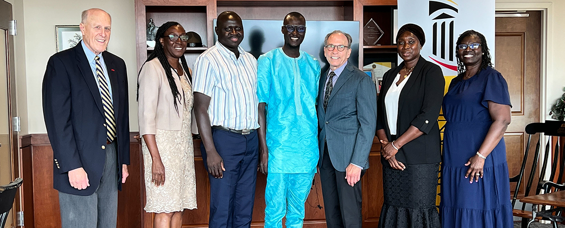 Visitors from Gambia pose with Dr. Jarrell and UMSON Professors