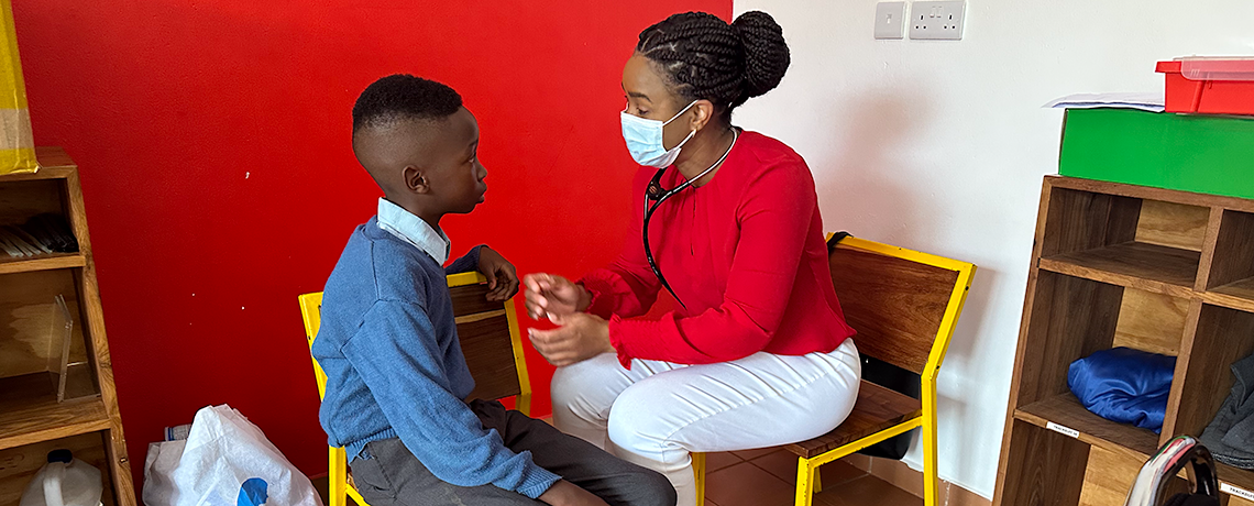 A student nurse interacts with a child