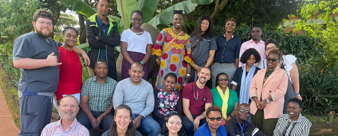 Students pose together on a global field trip in Tanzania