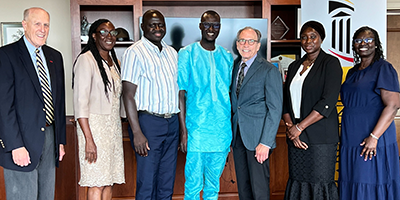 Visitors from Gambia pose with Dr. Jarrell and UMSON Professors