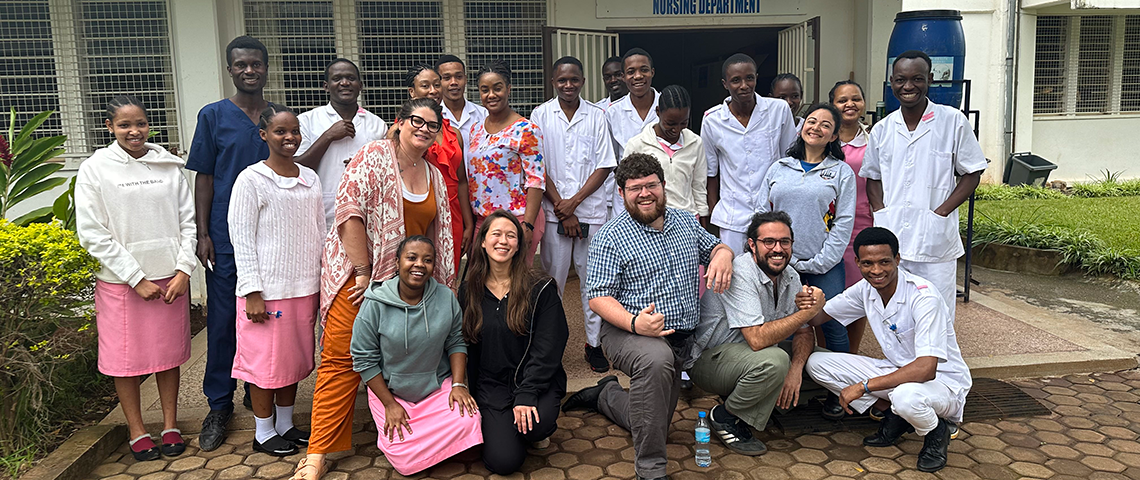 Students in Gambia posing with locals