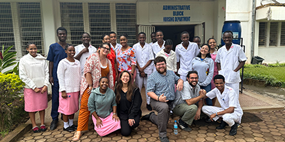 Students in Gambia posing with locals