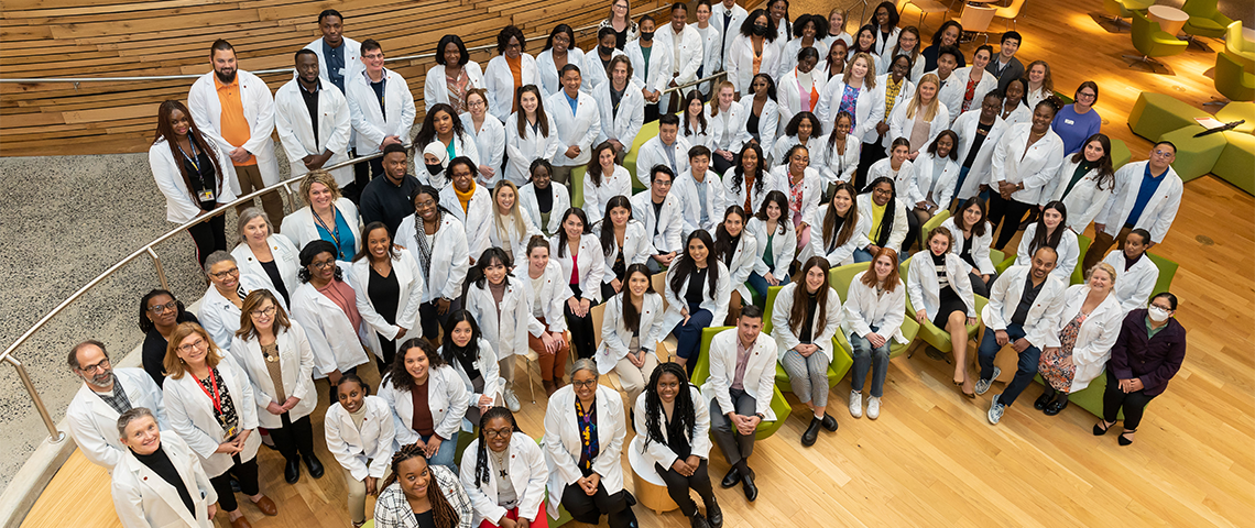 Group Photo of Students in White Coats