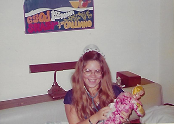 Girl Using a Doll as a Patient