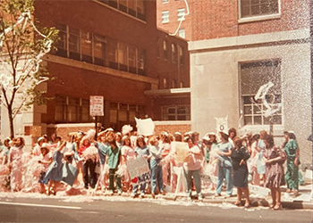Students celebrating graduation on Lombard Street