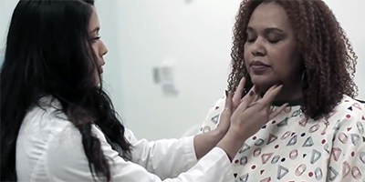 a student takes vitals on a standardized patient