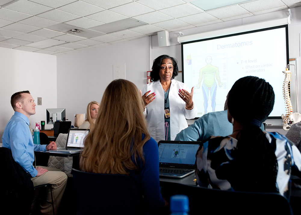 an UMSON professor talks enthusiastically to her class