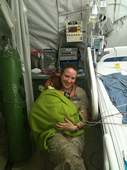 Casper and a patient during her time in Afghanistan