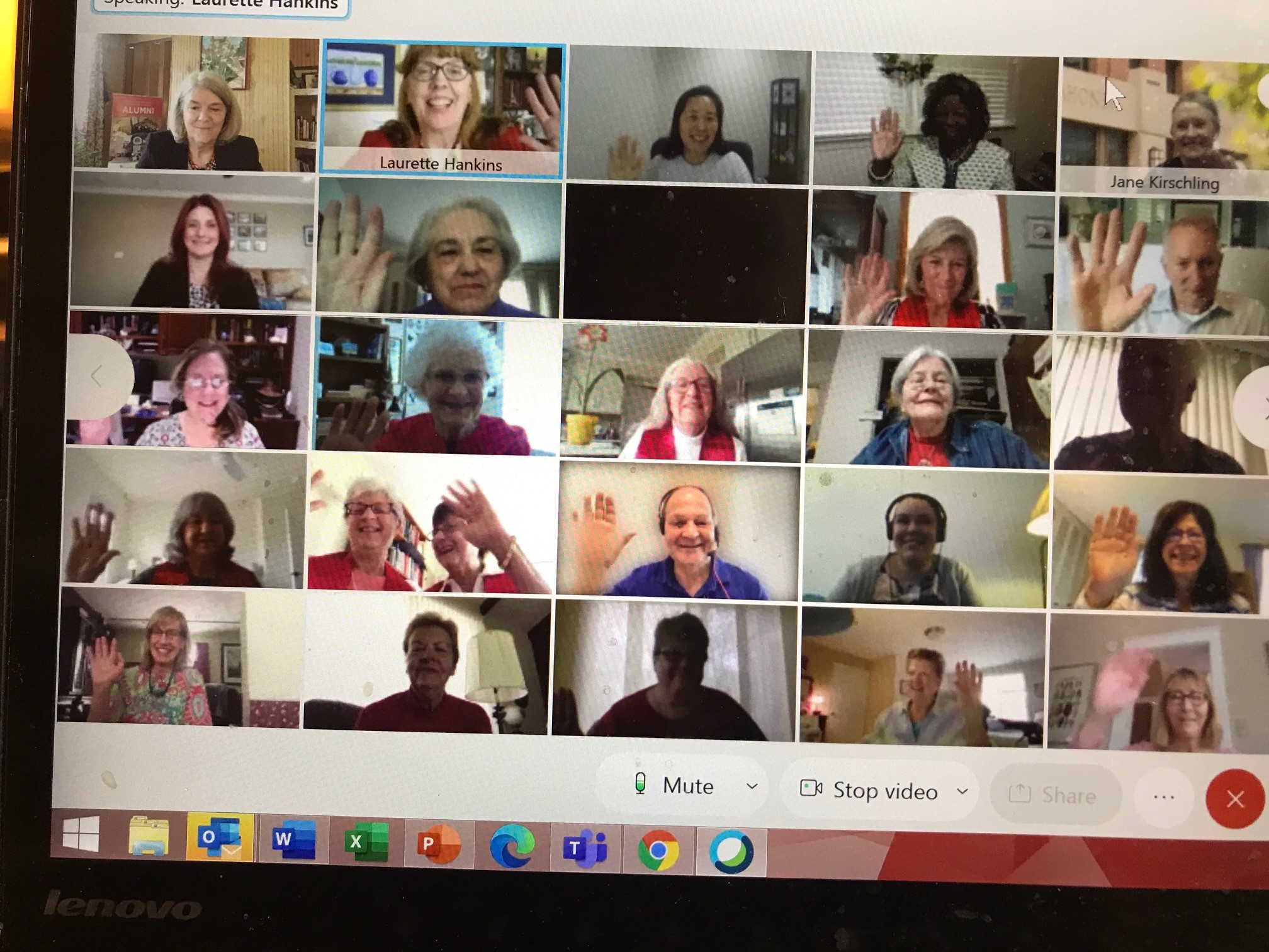 screenshot of alumni reunion attendees waving on screen