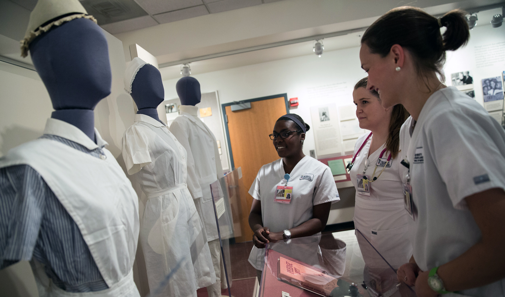 students looking at nursing uniforms in the Living History Museum