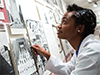 a student looks at a museum display