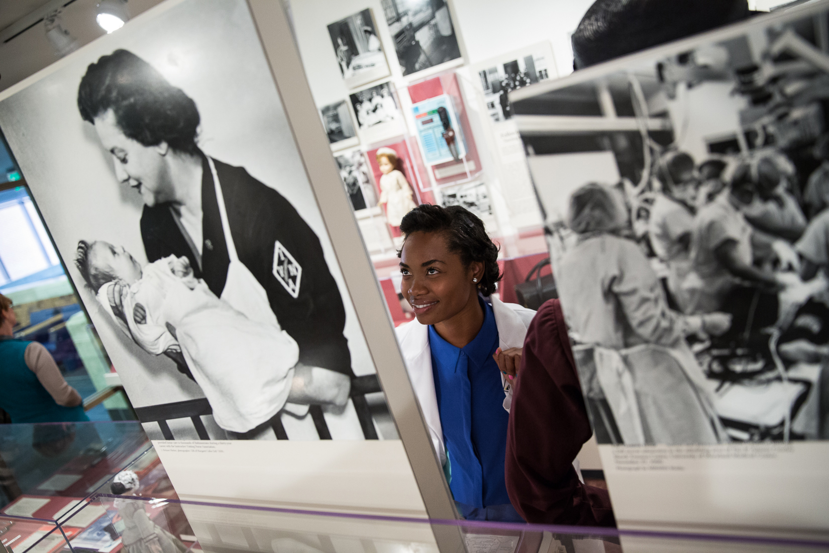 a nursing student looks at some of the items on display at the Living History Museum