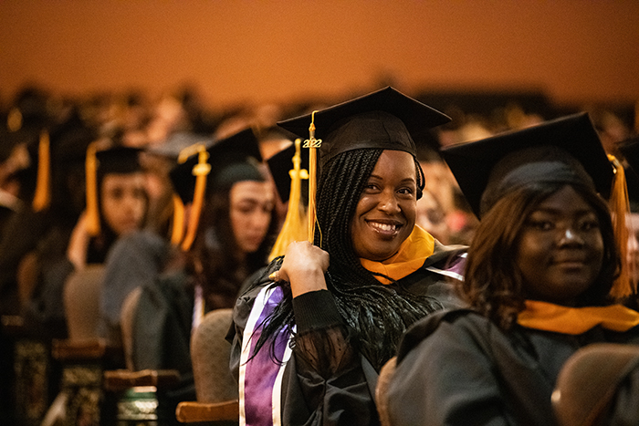 a graduating student with mortar board and 2022 on tassel, graduation