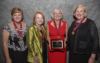 Haut with her award at the induction ceremony.