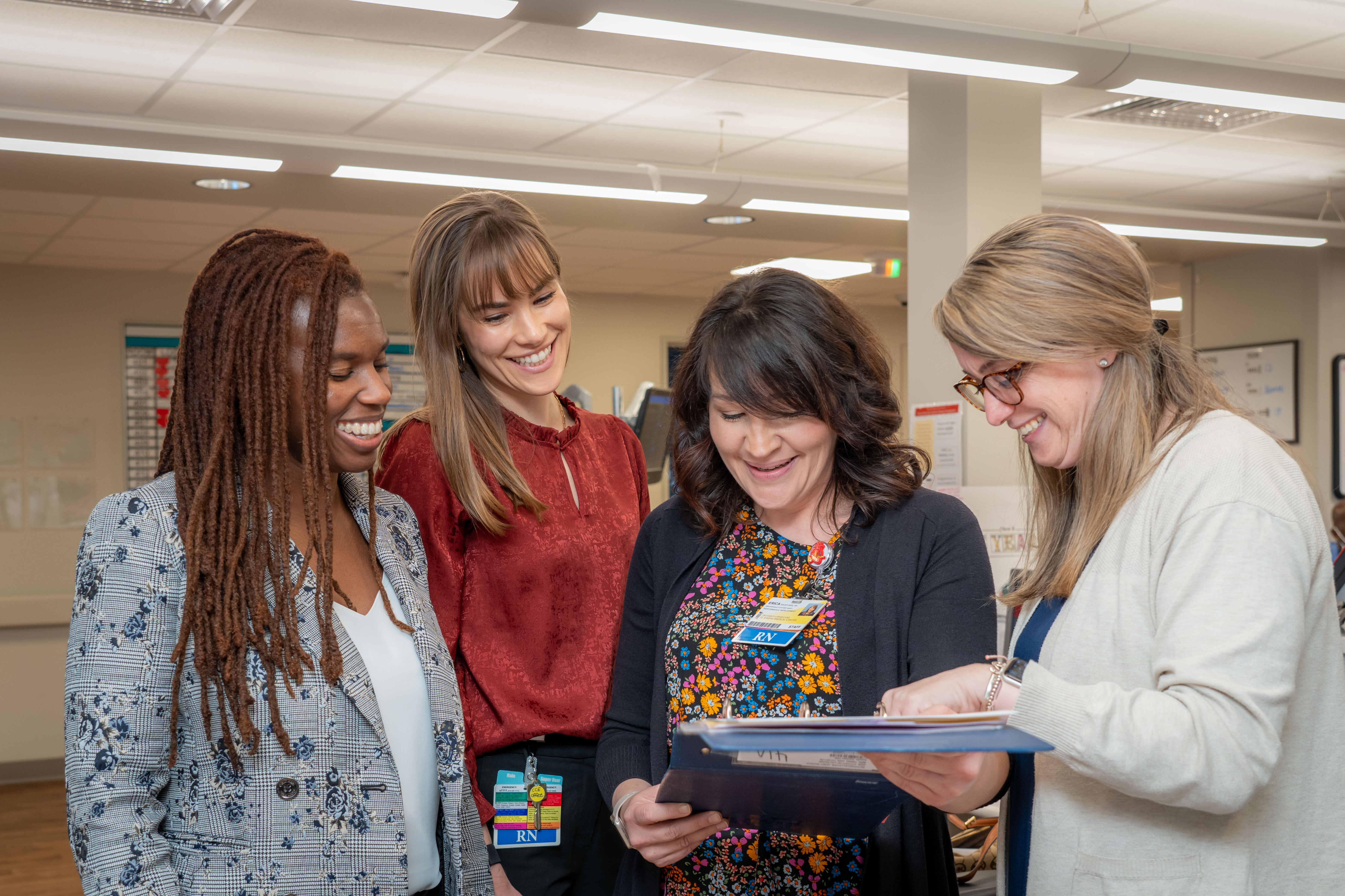 Group of women discussing a nursing program.