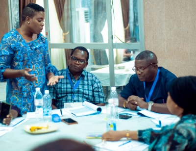 candid of Charlotte Nwogwugwu interacting with participants in BRAVE Project in Nigeria