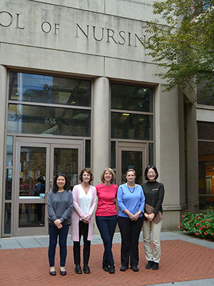 The five members of the research team in front of the School of Nursing
