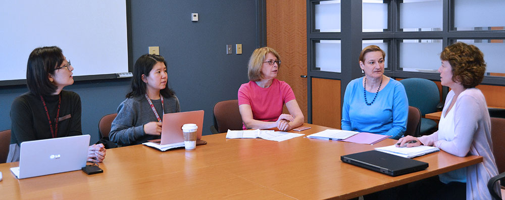 the NWWS research team sitting around a conference table